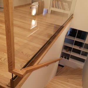 Wooden handrails on glass
