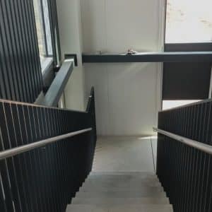 Metal handrail with armrest for staircase